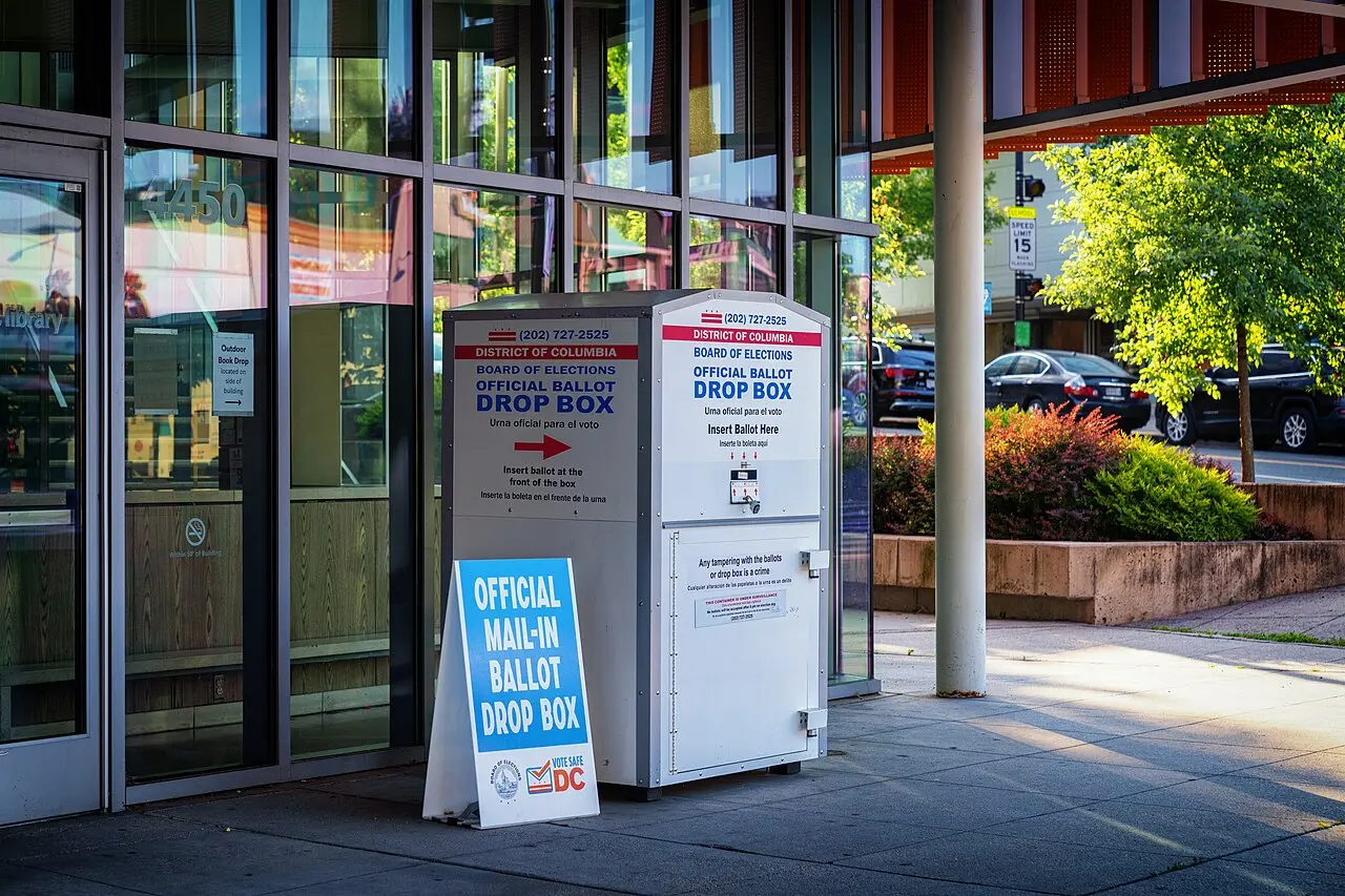 An official D.C. elections ballot drop box on a sidewalk.