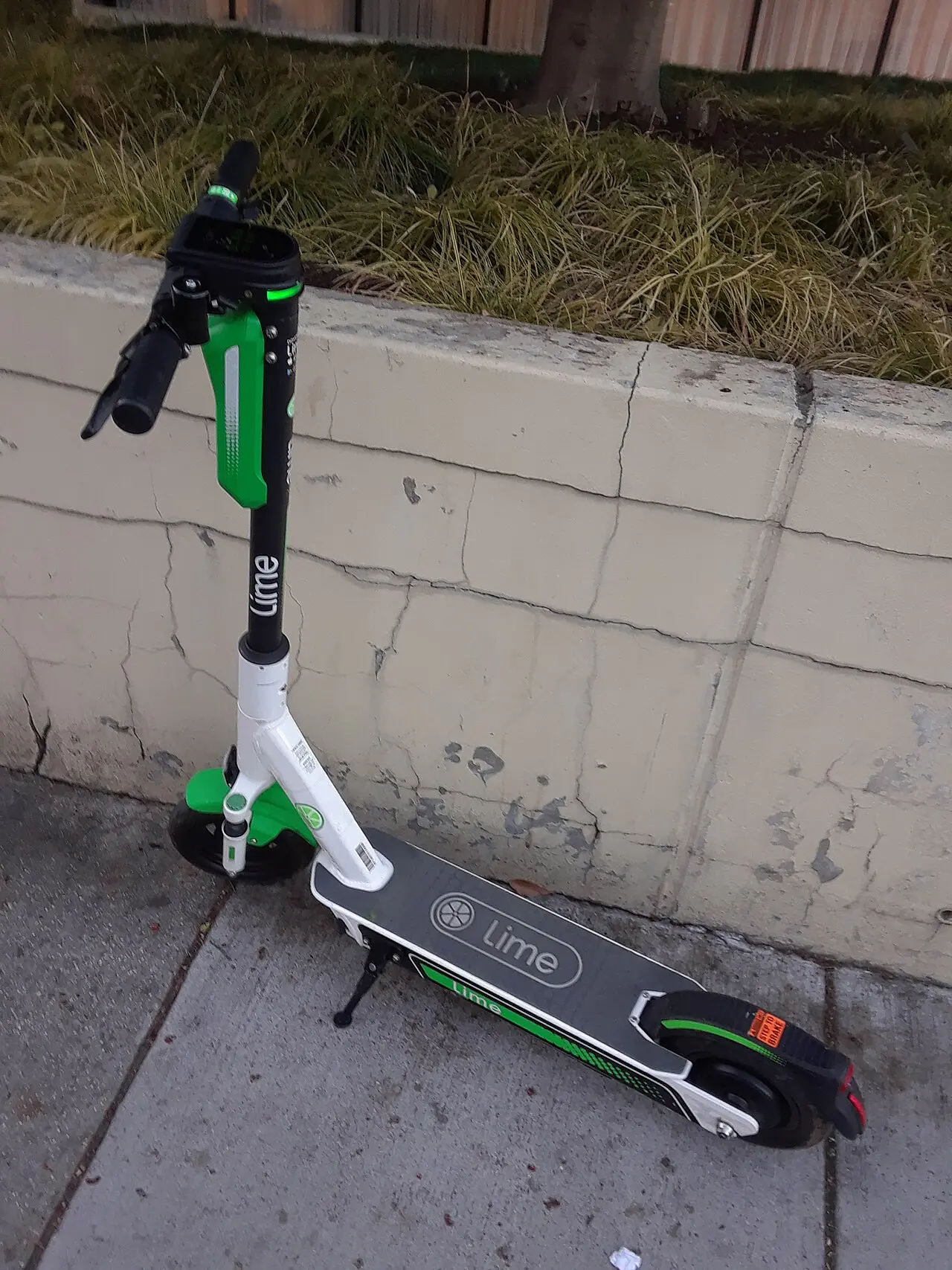 A shared electric scooter parked on a sidewalk in Foggy Bottom.